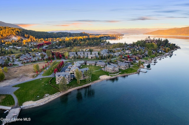 bird's eye view with a water and mountain view