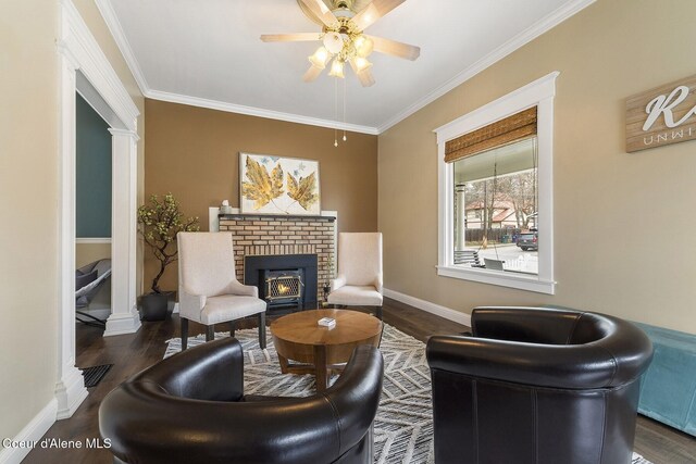 living area with dark wood-type flooring, ornamental molding, and ornate columns