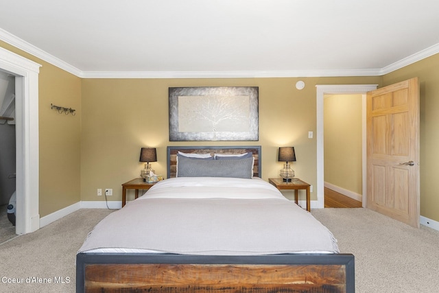 carpeted bedroom featuring baseboards and crown molding