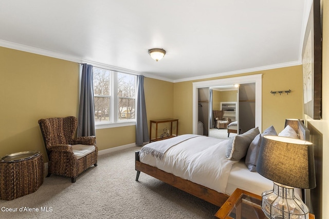 carpeted bedroom with ornamental molding and baseboards