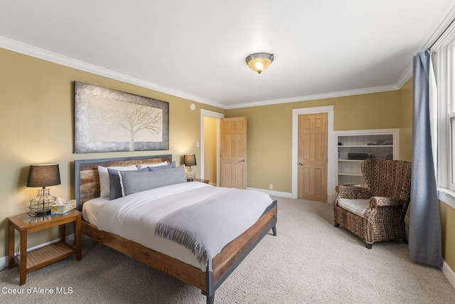 carpeted bedroom featuring ornamental molding and baseboards