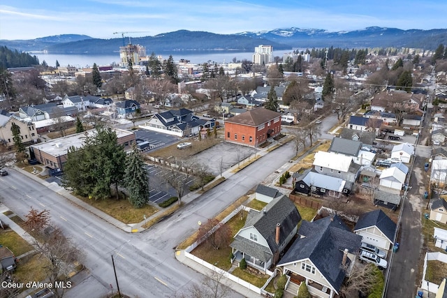 birds eye view of property featuring a water and mountain view