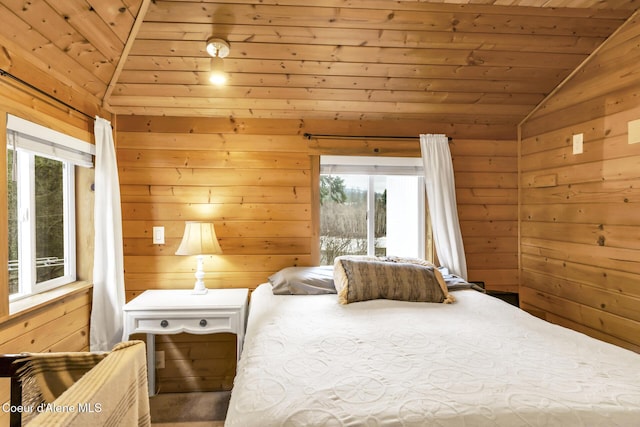 bedroom featuring lofted ceiling, wooden walls, and wooden ceiling