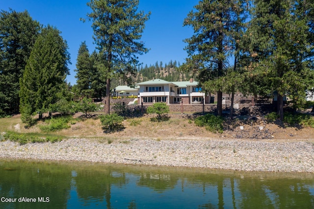 rear view of property featuring a water view