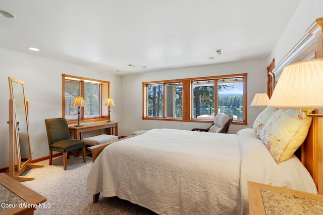 bedroom with carpet floors, recessed lighting, visible vents, and baseboards