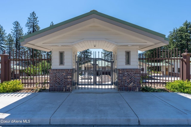 view of front of property featuring fence and a gate