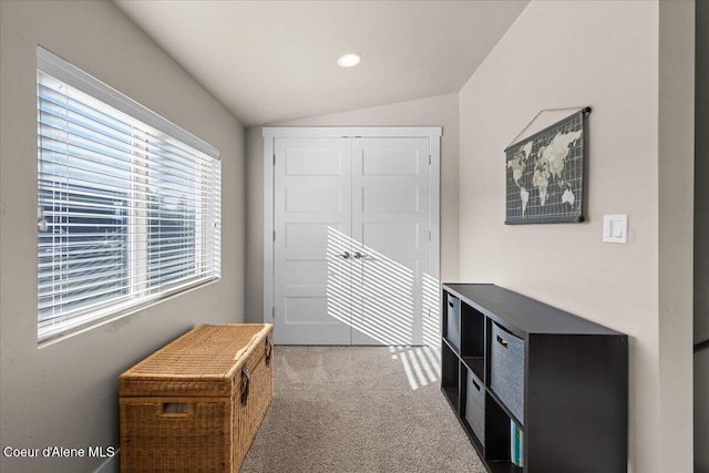 interior space featuring carpet floors, recessed lighting, and vaulted ceiling