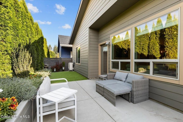 view of patio / terrace with fence and an outdoor living space