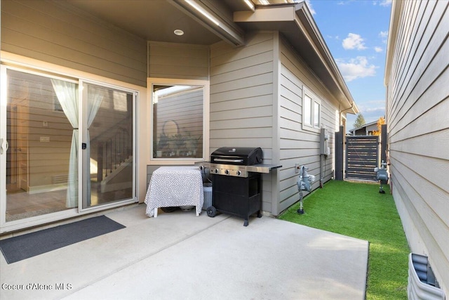 view of patio / terrace featuring area for grilling and fence