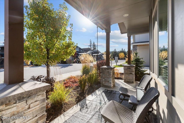 view of patio featuring a porch