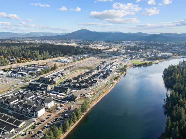 aerial view featuring a water and mountain view