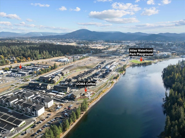 bird's eye view with a water and mountain view