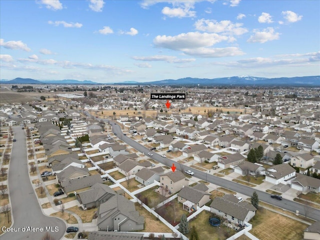 drone / aerial view with a residential view and a mountain view