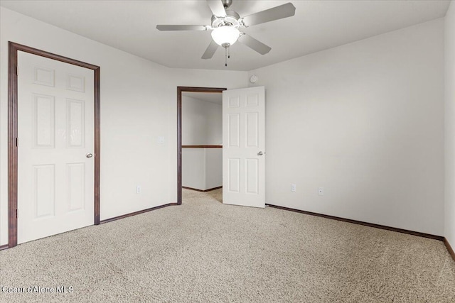 unfurnished bedroom featuring a ceiling fan, baseboards, a closet, and light carpet