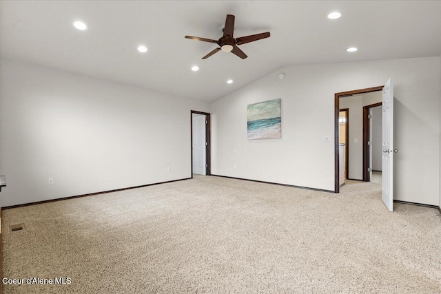 empty room with recessed lighting, light colored carpet, a ceiling fan, and vaulted ceiling