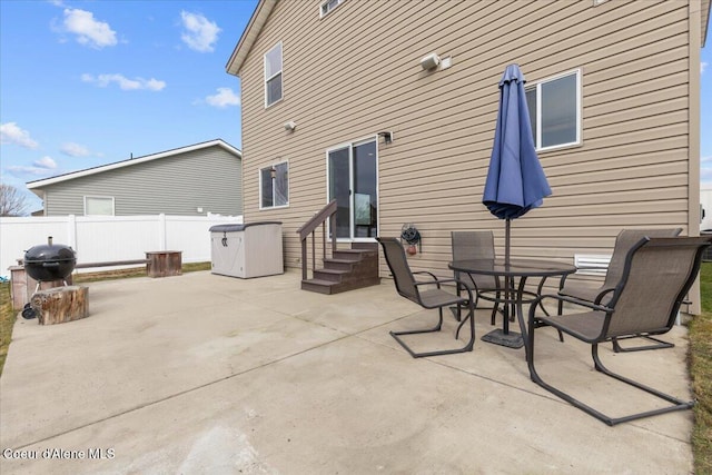 view of patio / terrace featuring entry steps and fence