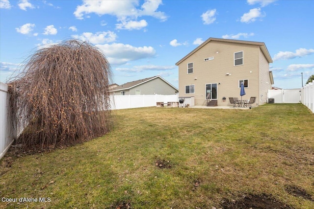 back of property with a fenced backyard, central air condition unit, a patio, and a yard