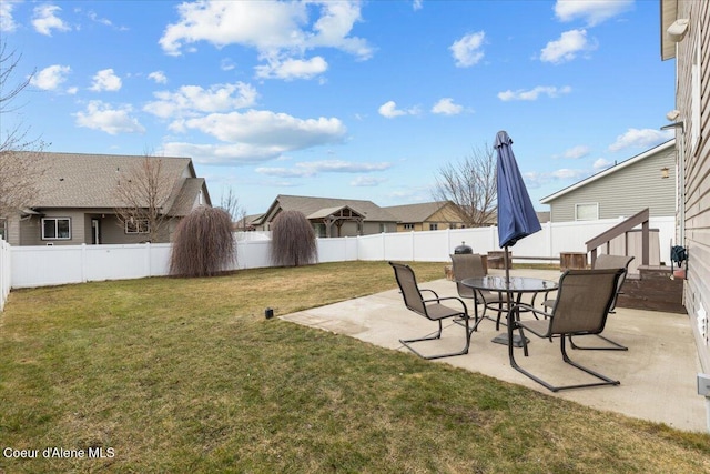 view of yard featuring a patio and a fenced backyard