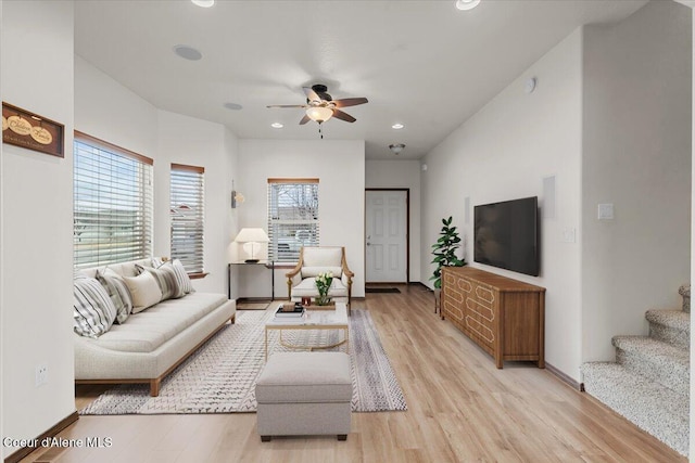 living area with recessed lighting, baseboards, light wood-style flooring, and a ceiling fan