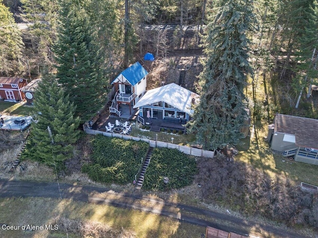 birds eye view of property with a view of trees