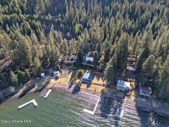 birds eye view of property with a view of trees