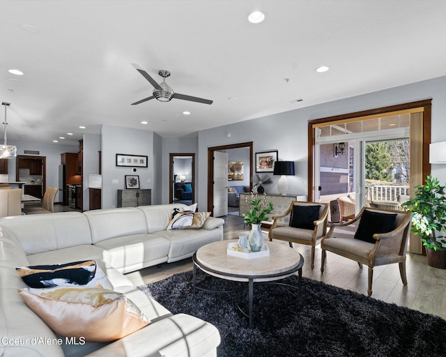 living room featuring ceiling fan, wood finished floors, and recessed lighting