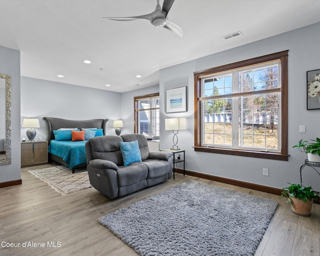 bedroom featuring recessed lighting, visible vents, baseboards, and wood finished floors