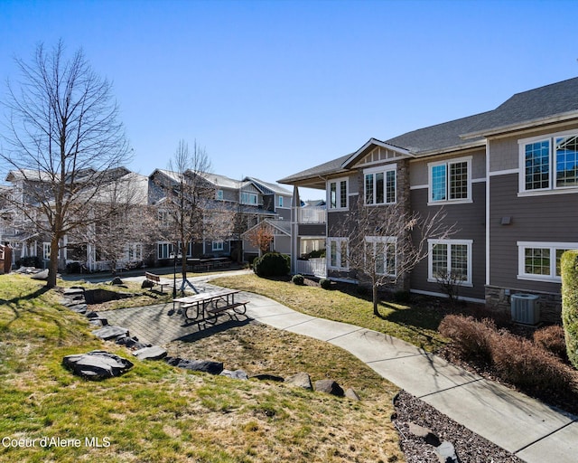 surrounding community featuring a residential view and a lawn