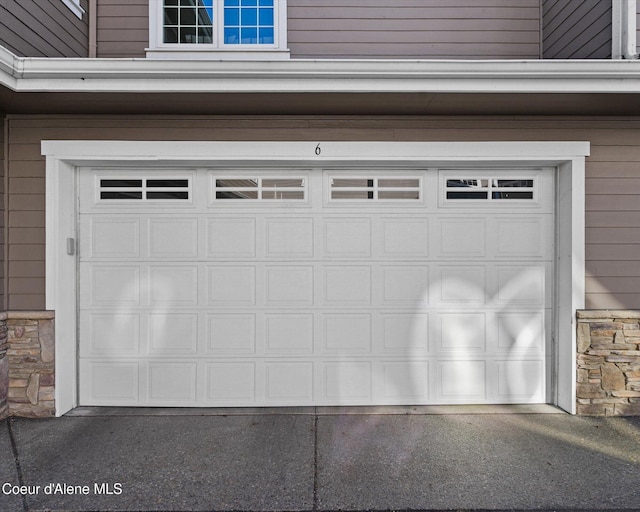 garage featuring driveway