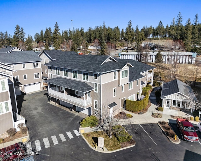 birds eye view of property with a residential view