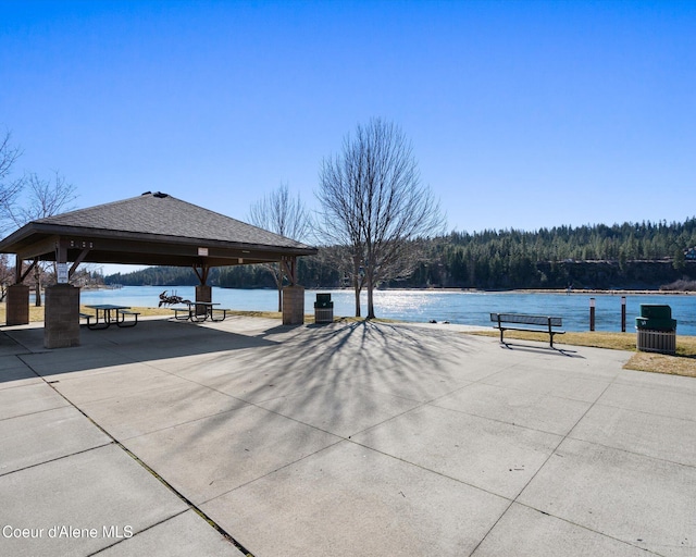 view of property's community with a gazebo and a water view