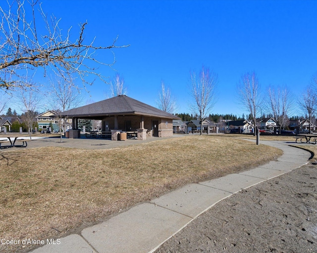 view of property's community with a gazebo and a yard