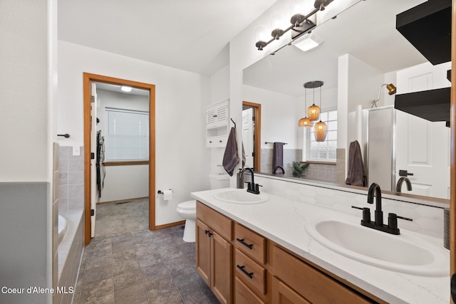 2645 W Bolivar Ave, Coeur Dalene, ID 83815 - full bathroom featuring toilet, a sink, a shower, and double vanity