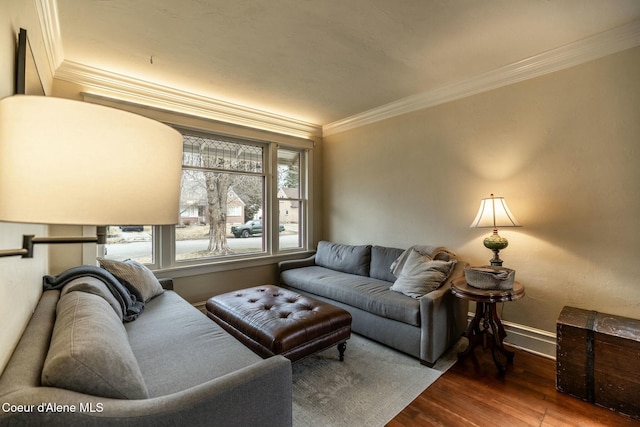 living room featuring ornamental molding, wood finished floors, and baseboards