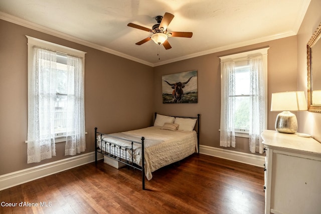 bedroom with baseboards, ceiling fan, dark wood-style flooring, and crown molding