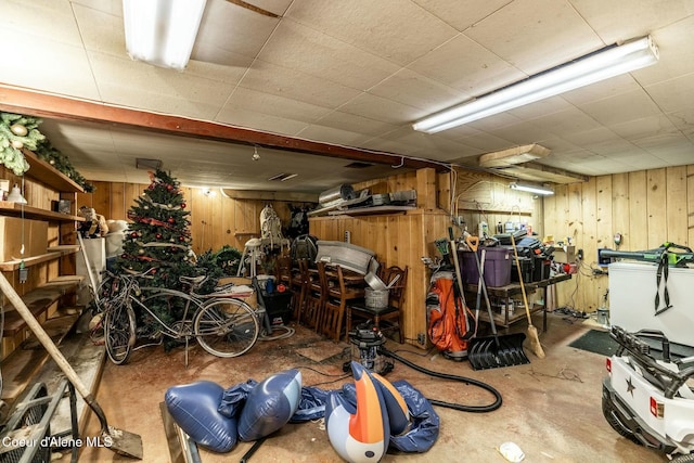 garage featuring wooden walls