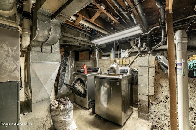 utility room with independent washer and dryer