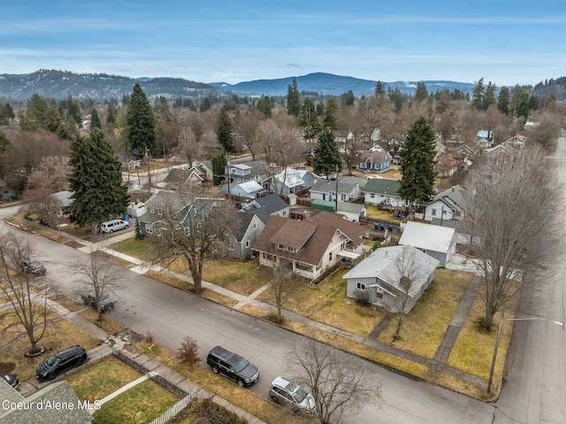 birds eye view of property with a mountain view and a residential view