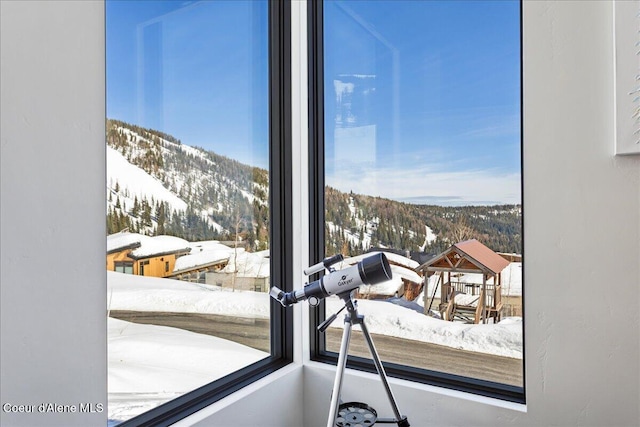 interior space featuring plenty of natural light and a mountain view