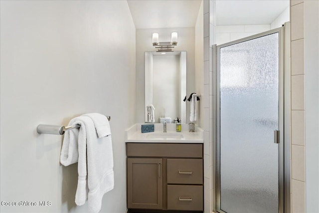 bathroom featuring a stall shower and vanity