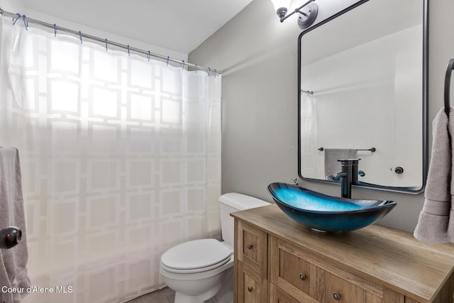 full bath featuring toilet and vanity