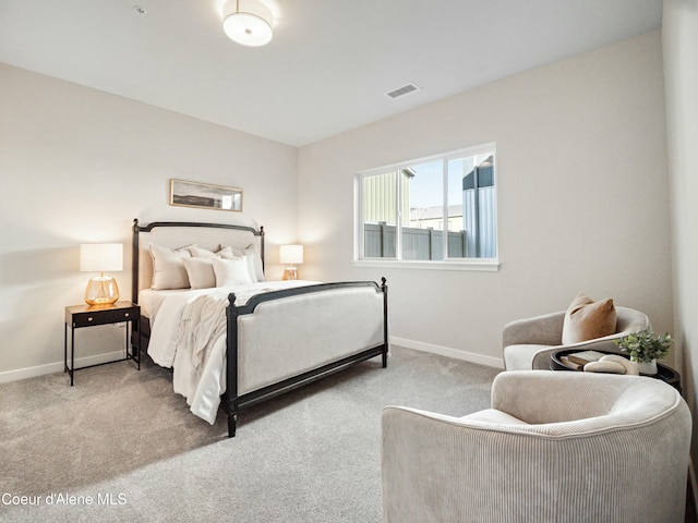 bedroom with visible vents, carpet floors, and baseboards