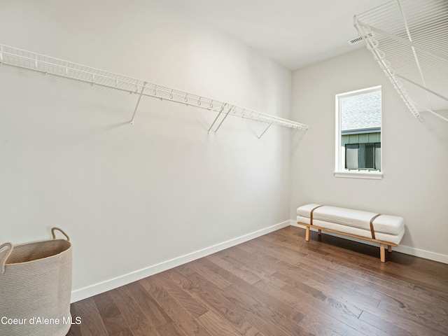 spacious closet with wood finished floors and visible vents