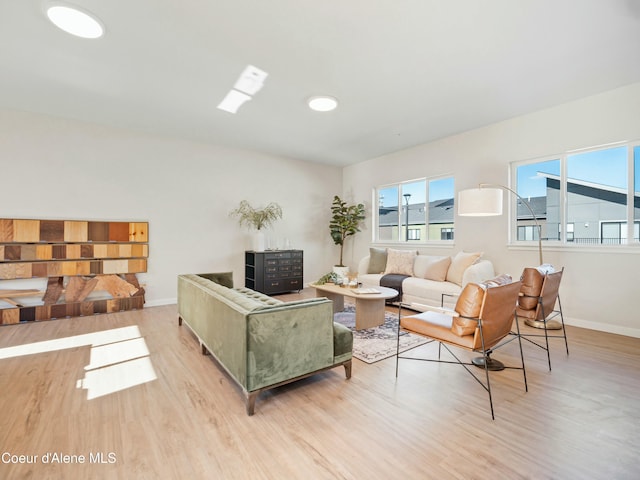 living room featuring baseboards and wood finished floors