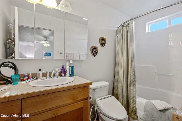 full bath featuring toilet, vanity, ceiling fan, and shower / bath combo