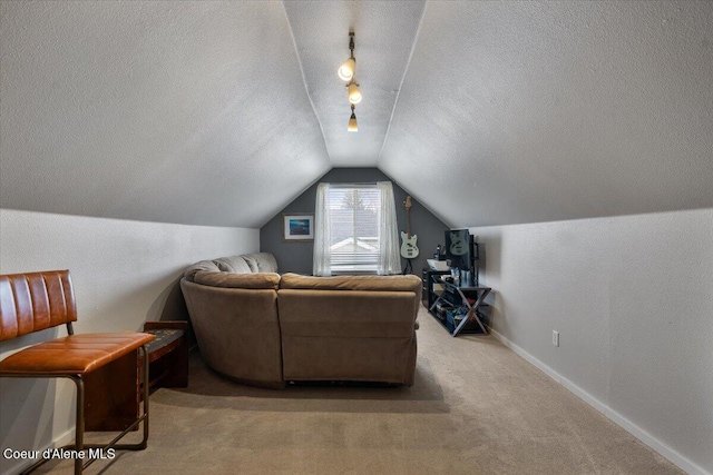 interior space with carpet, baseboards, vaulted ceiling, and a textured ceiling