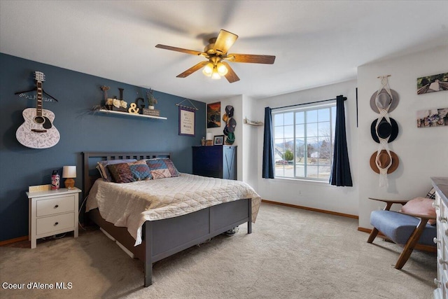 bedroom with carpet flooring, a ceiling fan, and baseboards