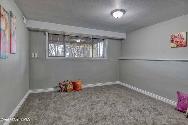 game room featuring visible vents, baseboards, a textured ceiling, and carpet flooring