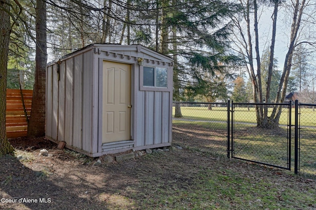 view of shed with a gate and fence