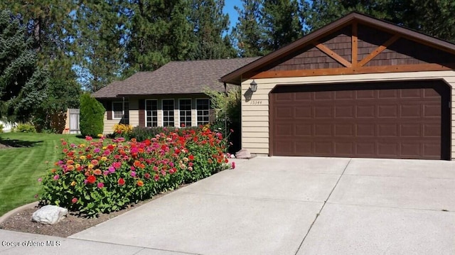 single story home featuring driveway and a front yard